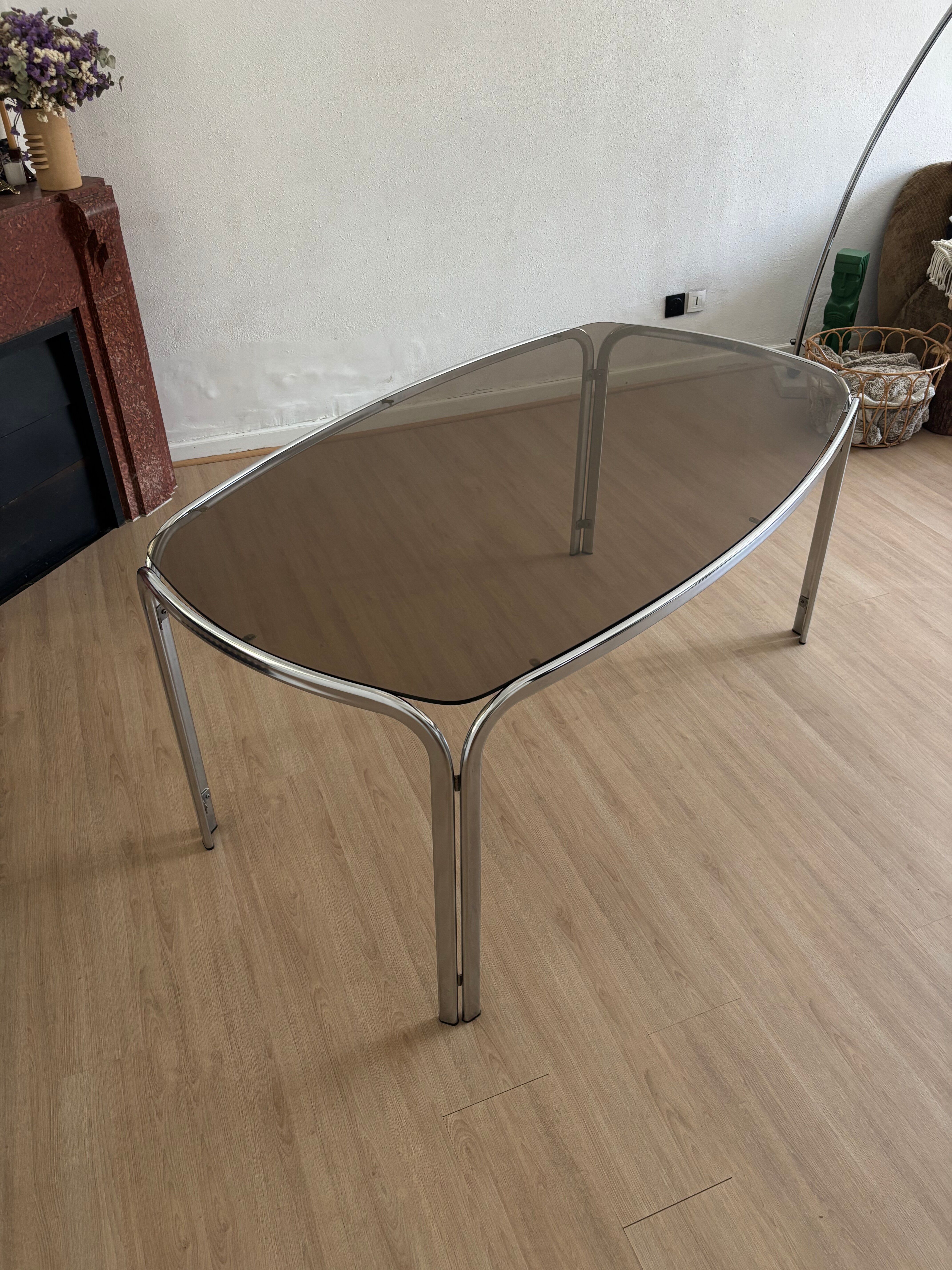 Smoked glass dining table from the 1970s.