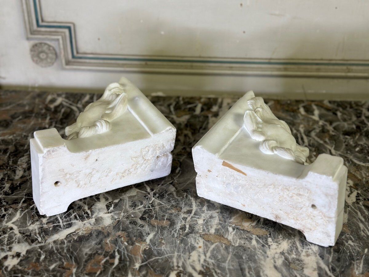 Pair of white statuary marble consoles, with faun heads