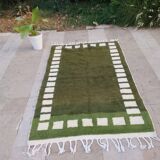 Handwoven Moroccan rug, natural wool, 250cm x 150cm, elegant decoration.