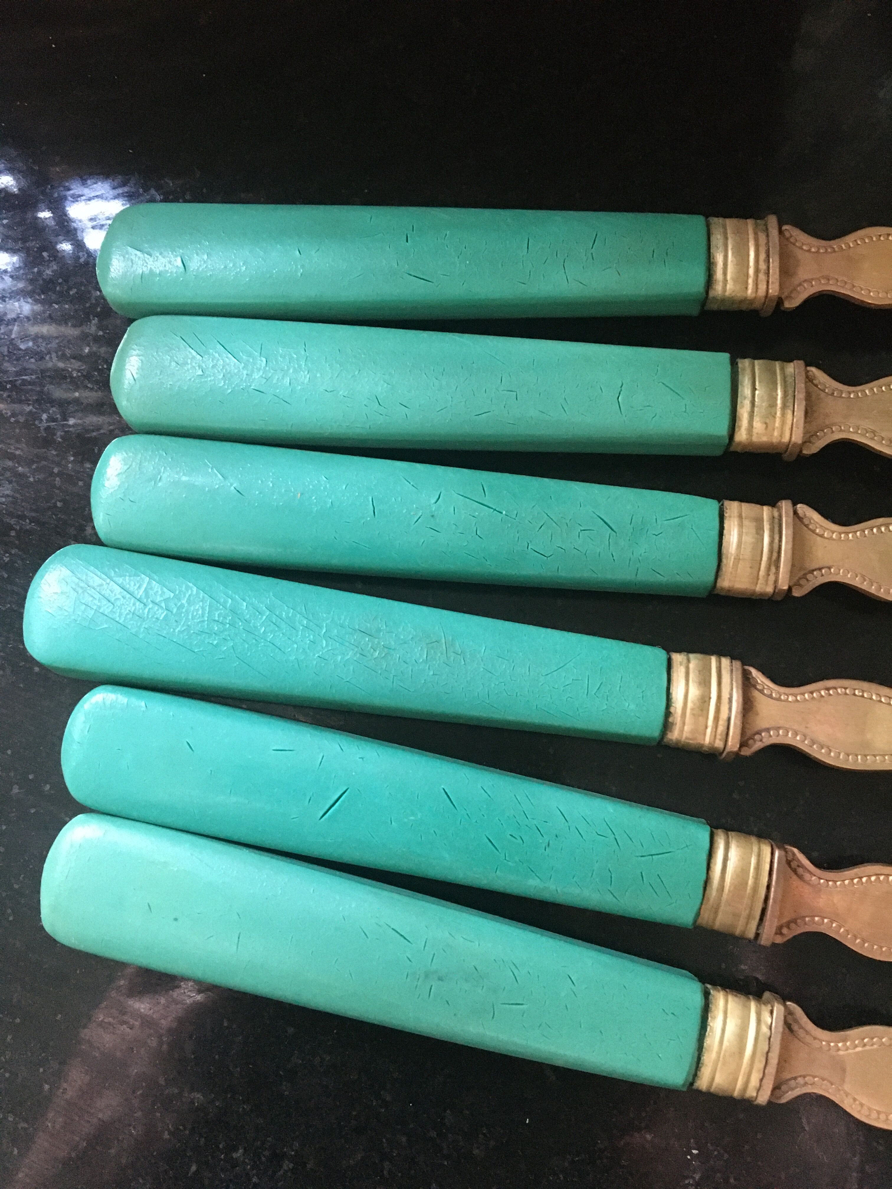 Set of brass dessert forks