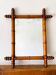 Vintage wooden mirror imitating bamboo