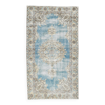 Tapis oriental vintage bleu ciel à motifs classiques