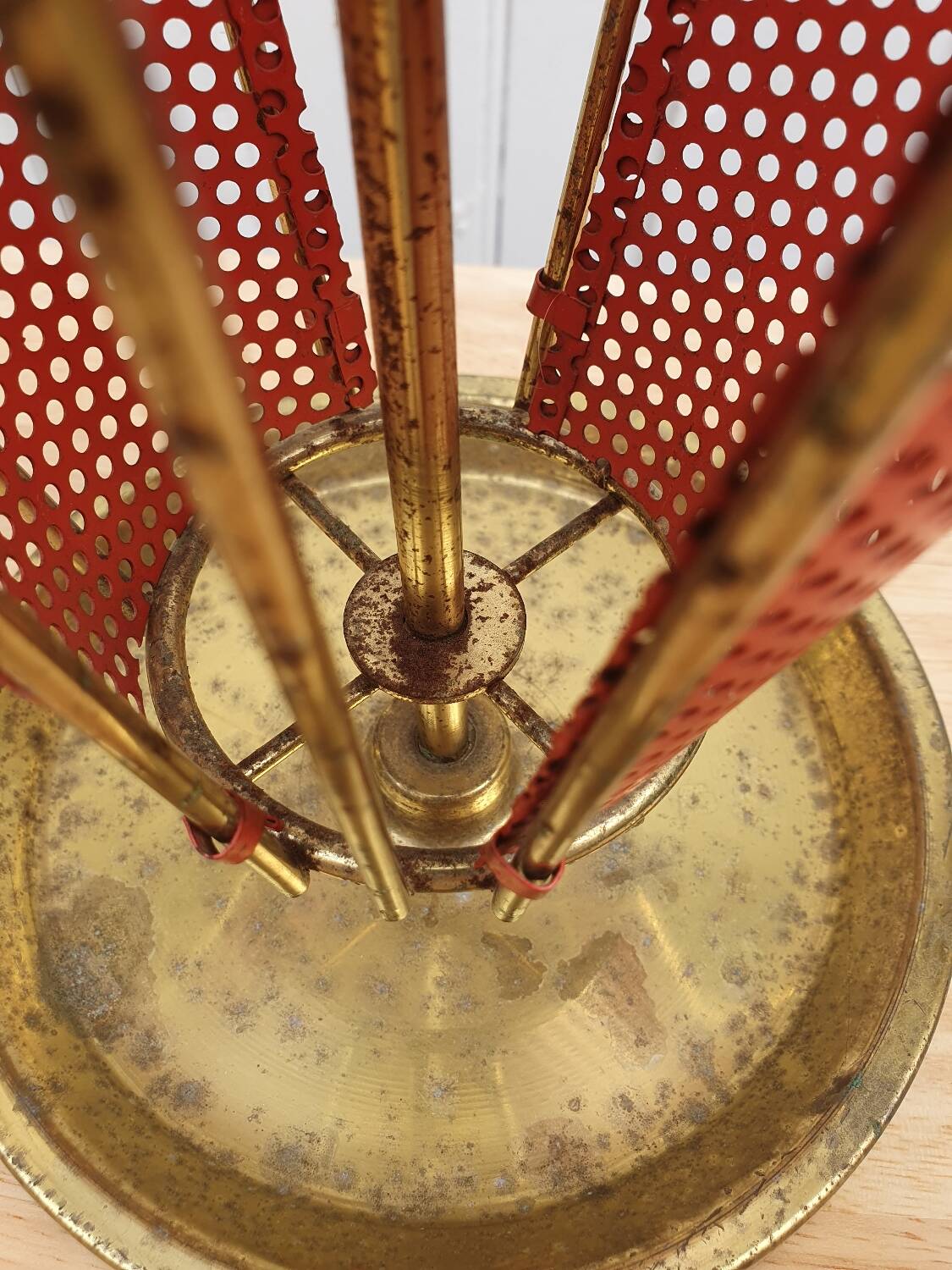 Perforated metal umbrella stand and scoubidou