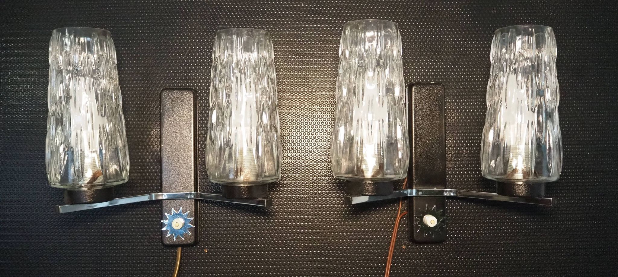 Pair of wall lights from the 1950s-1960s with a push button switch.