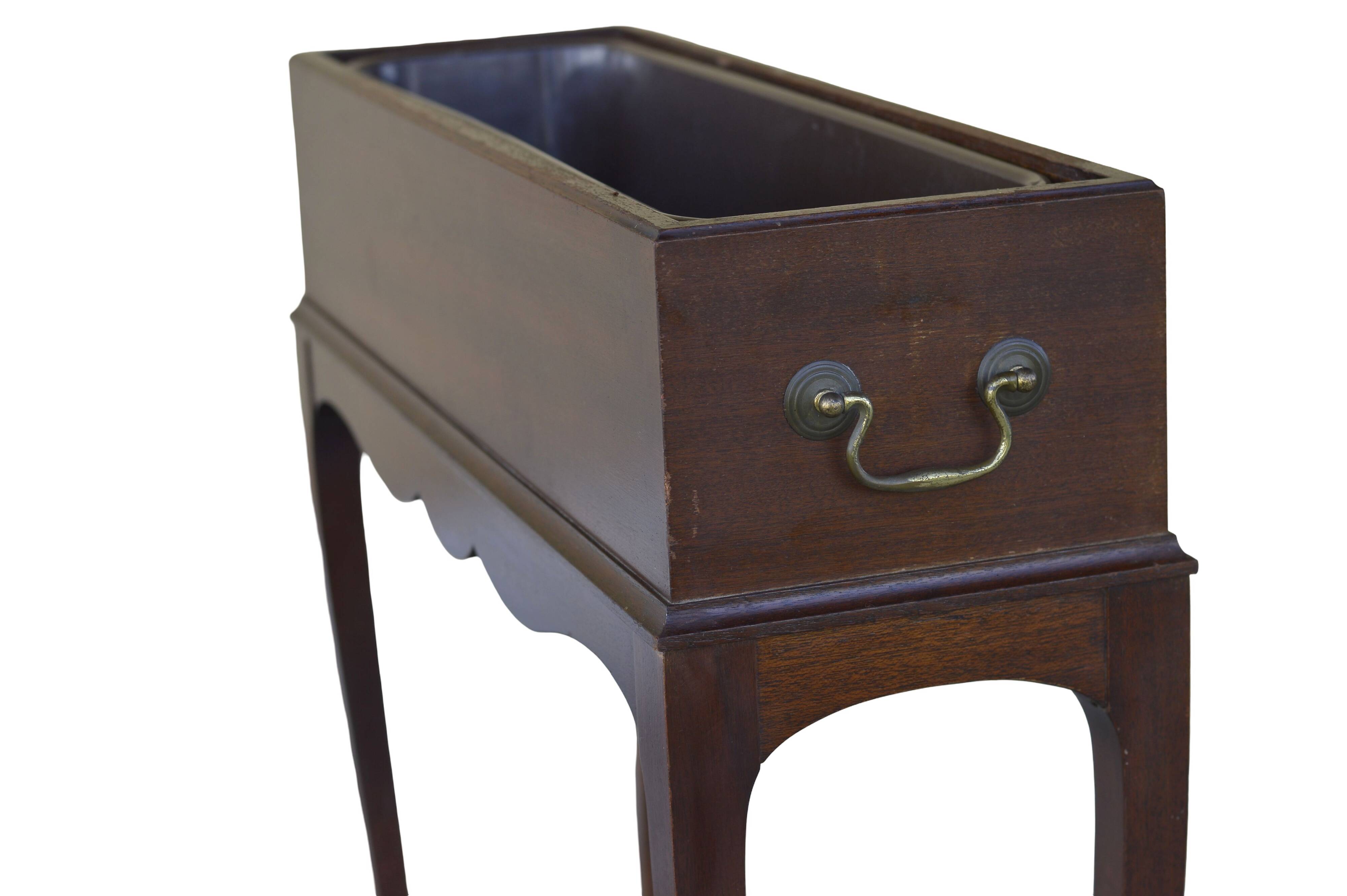Elegant mid-century teak planter with tray.