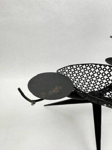 Candlestick sculpture in perforated iron clover motif