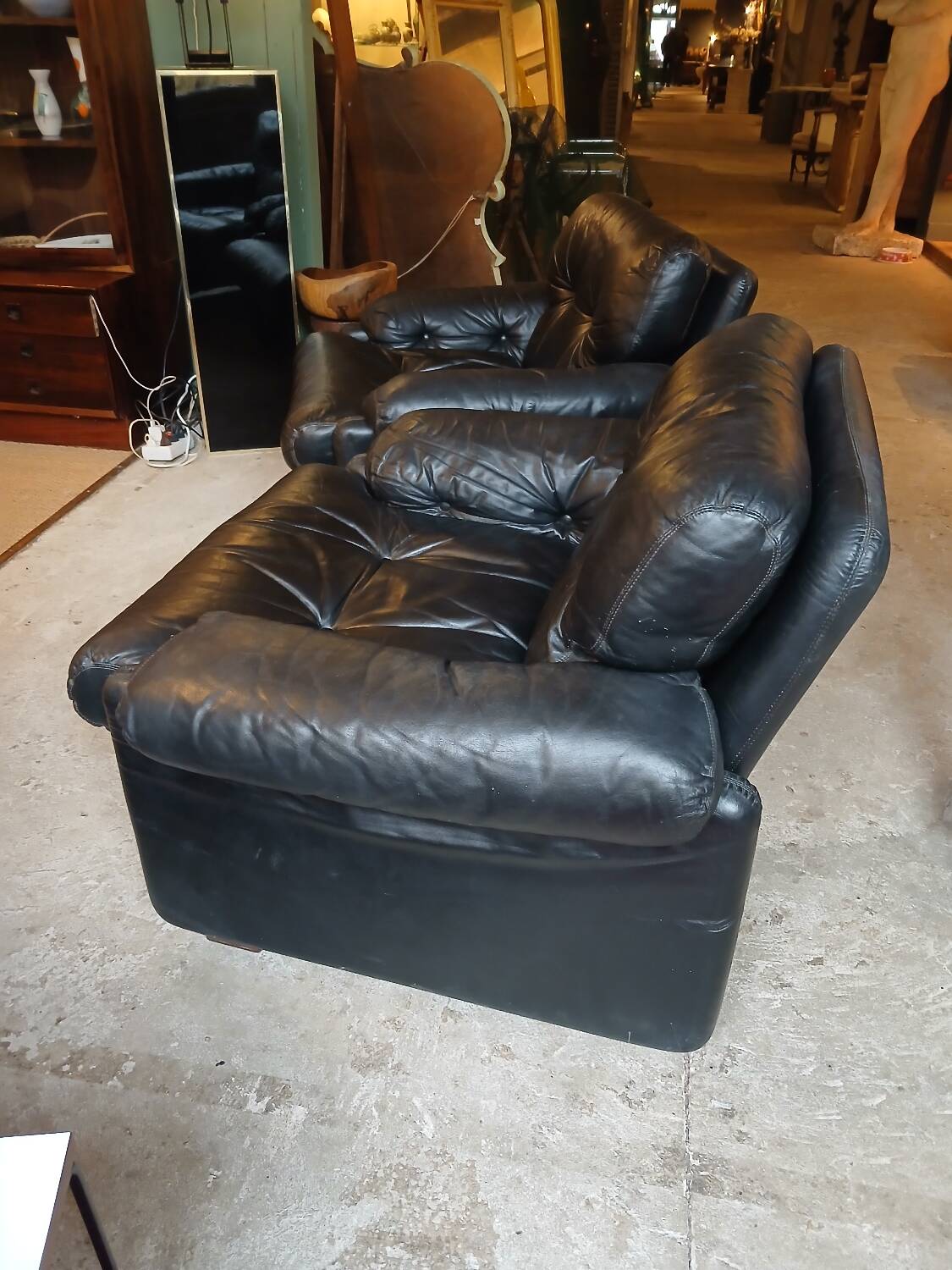 Pair of designer leather armchairs by Tobia Scarpa