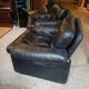 Pair of designer leather armchairs by Tobia Scarpa.