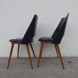 2 chaises en skaï noir pieds compas Louis Paolozzi