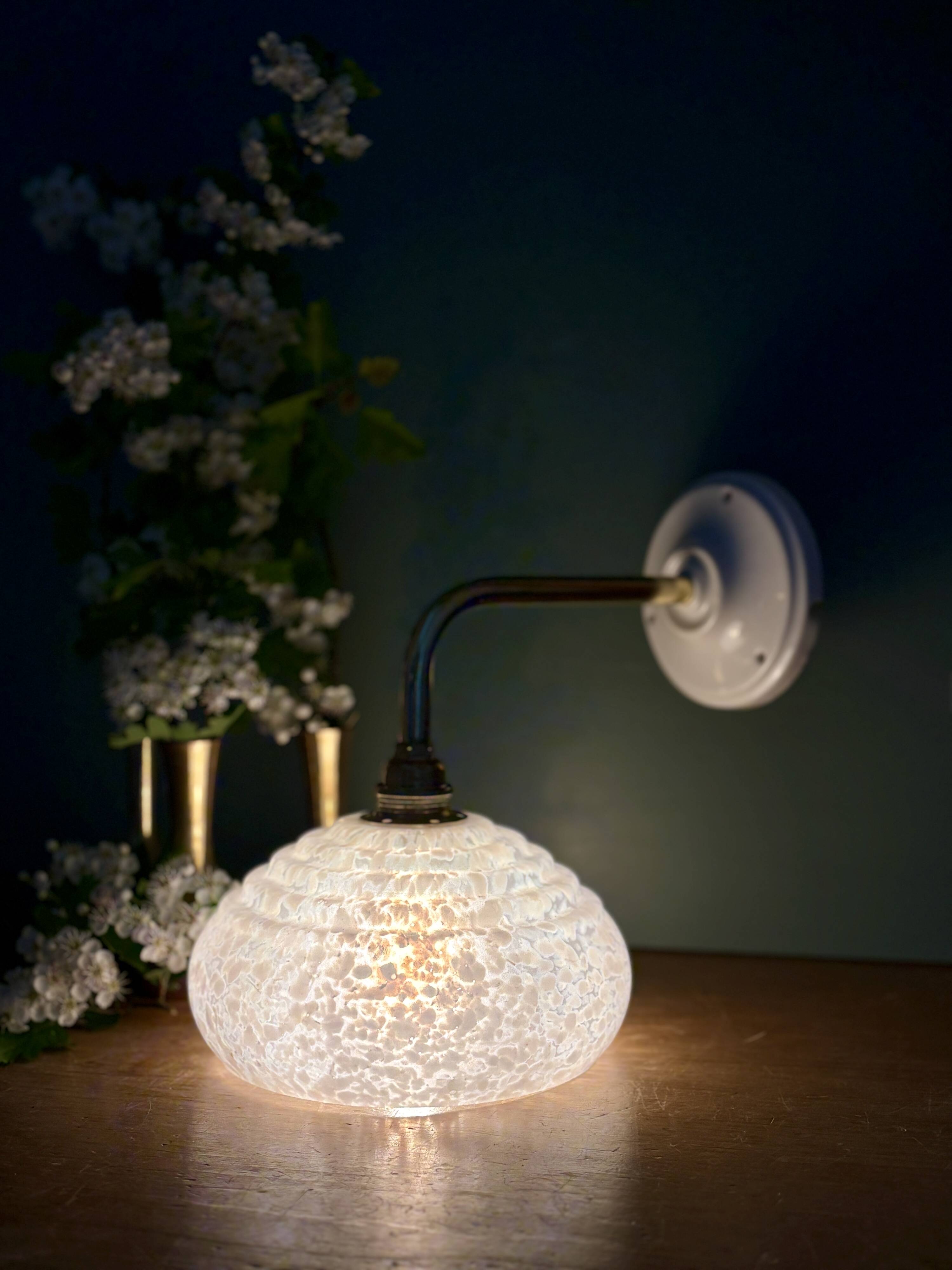Vintage glass wall lamp with a white Clichy shade.