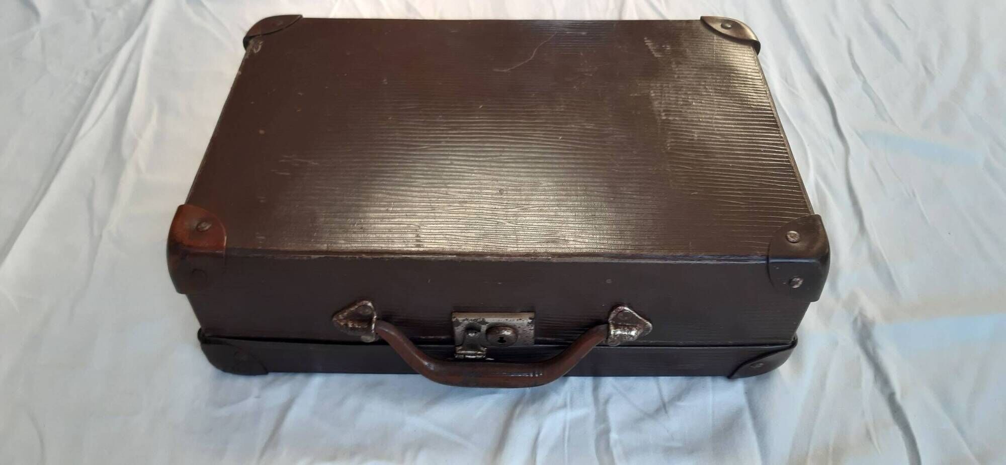 Small old suitcase with a ribbed appearance