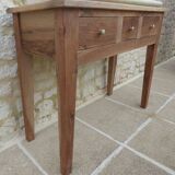 Console in solid walnut with a natural finish, featuring three drawers with a belt.