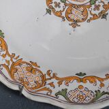 Two 18th century earthenware plates with grand feu decoration in ochre, green and manganese