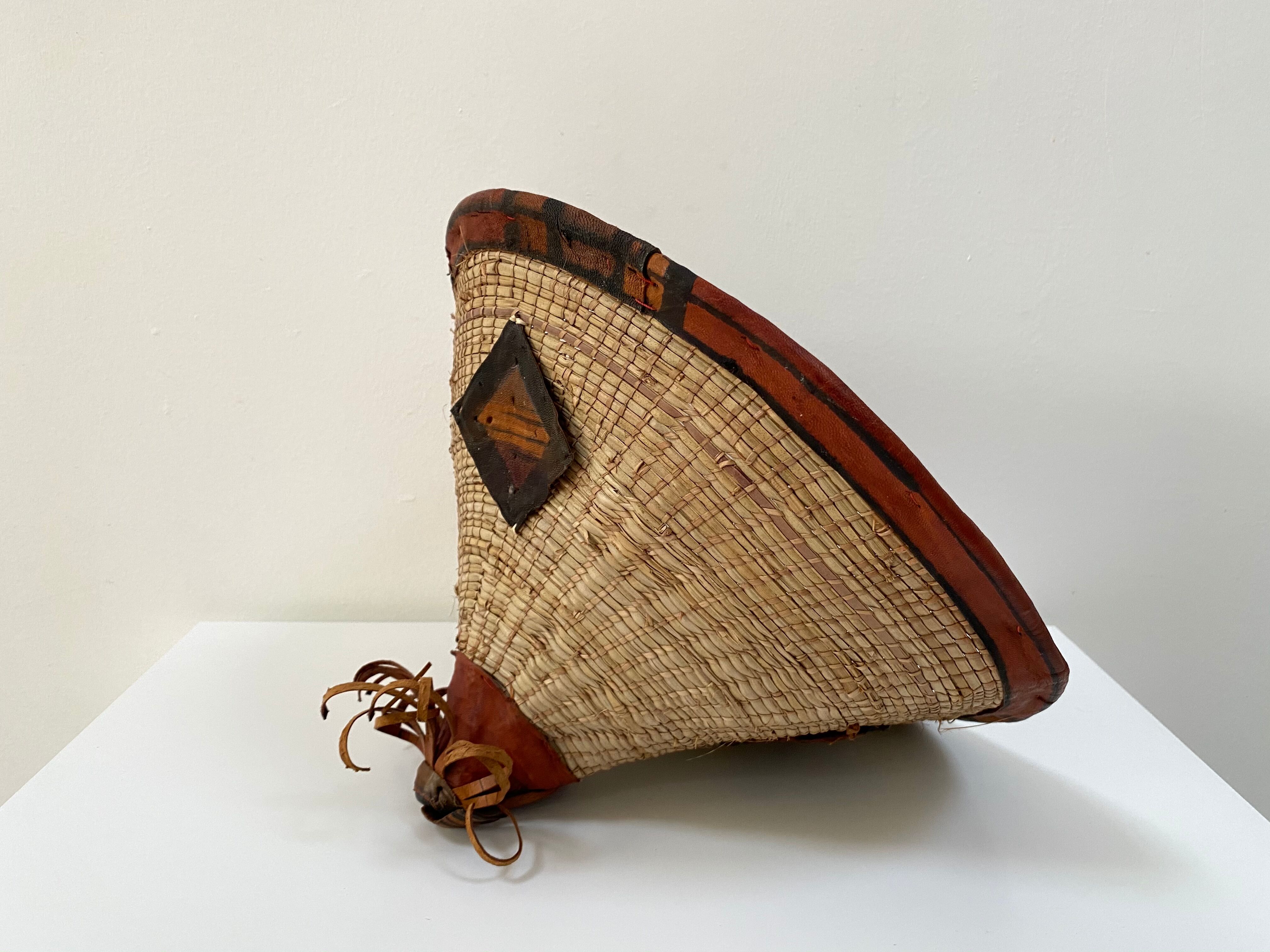Traditional African Fulani hat in leather and woven straw