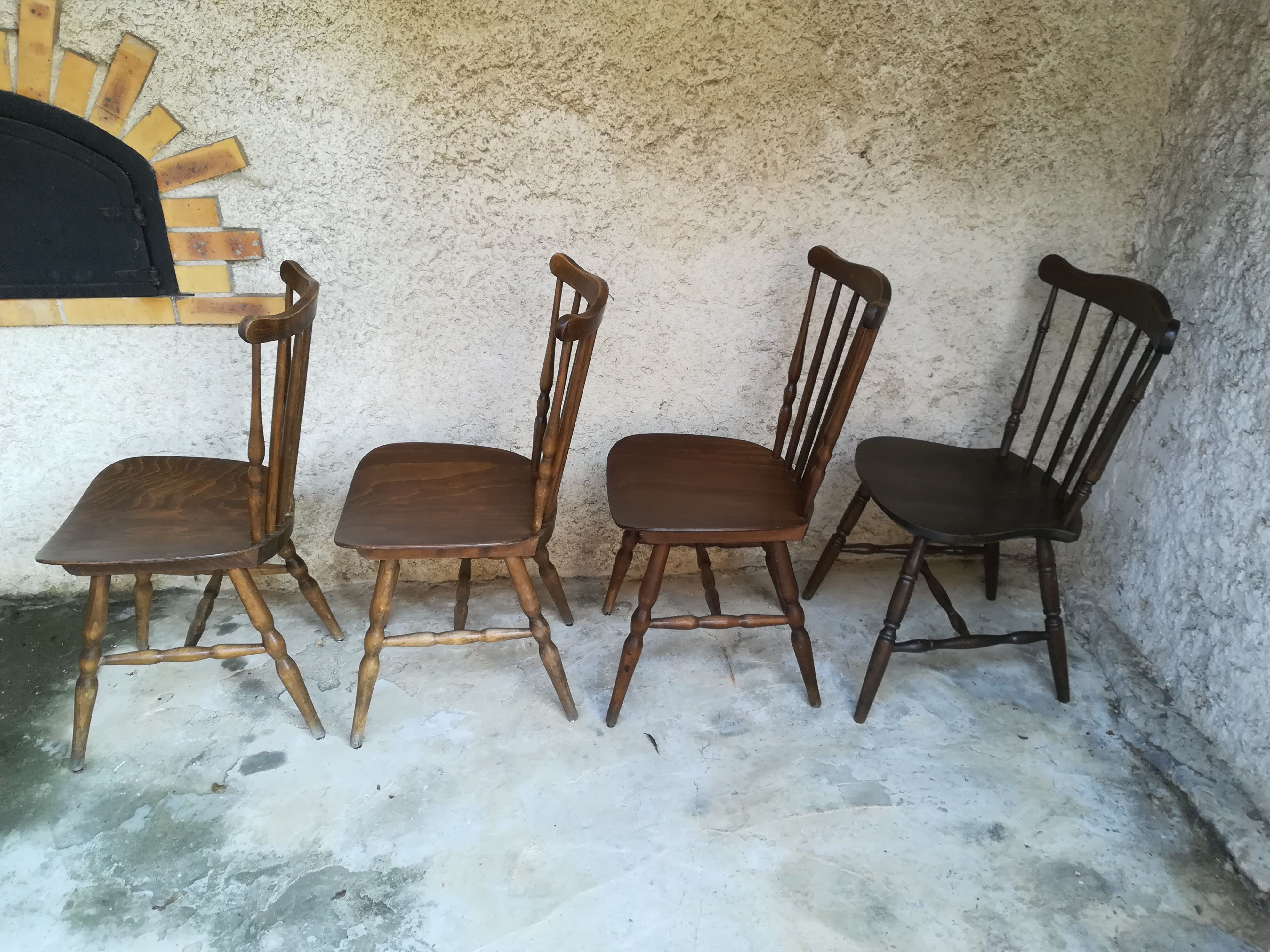 Eight mismatched bistro chairs