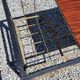 Coffee table from the 60s in black and gold metal tubes mahogany formica top