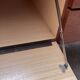 Teak sideboard with flap, 2 drawers and conical legs.