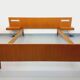 Double bed in vintage Scandinavian style from the 1960s with bedside tables.