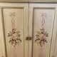 2-door flowered wooden cabinet