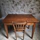 Old French table in cherry wood with bistro chair, circa 1900–1930.