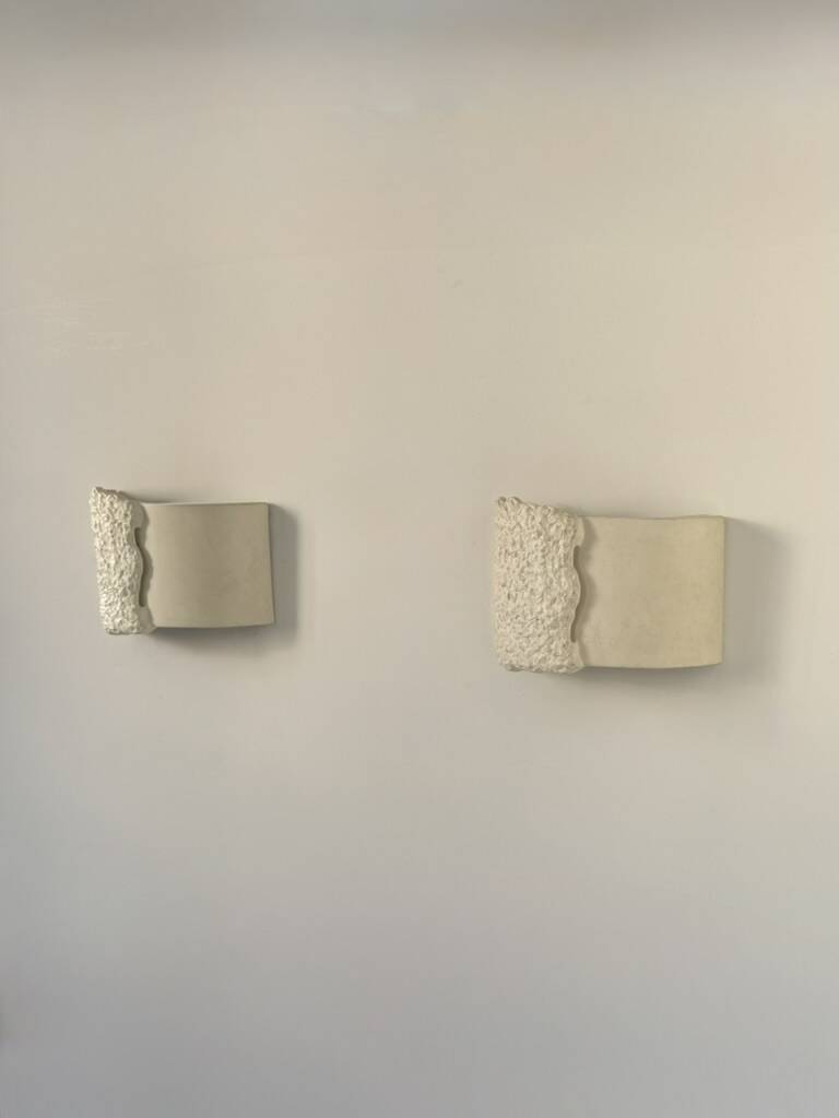 Pair of vintage wall lights in smooth plaster and stone imitation, France, 1970.