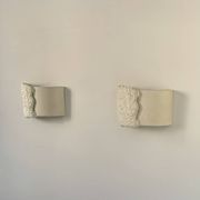Pair of vintage wall lights in smooth plaster and stone imitation, France, 1970.