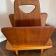 Magazine rack, in oak, by Pierre Cruège