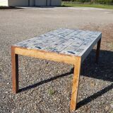 Teak dining table with illustrated top
