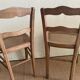 Set of two antique chairs with caning.