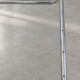 Coffee table in chrome with a glass top.