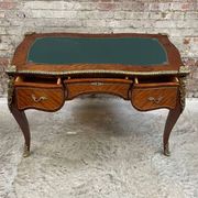 Antique French-style desk with green leather top and bronze mounts