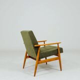 Mid-century modern design armchair in olive green corduroy.