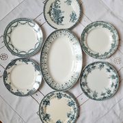 Old flat plates mismatched in iron earth accompanied by a serving dish