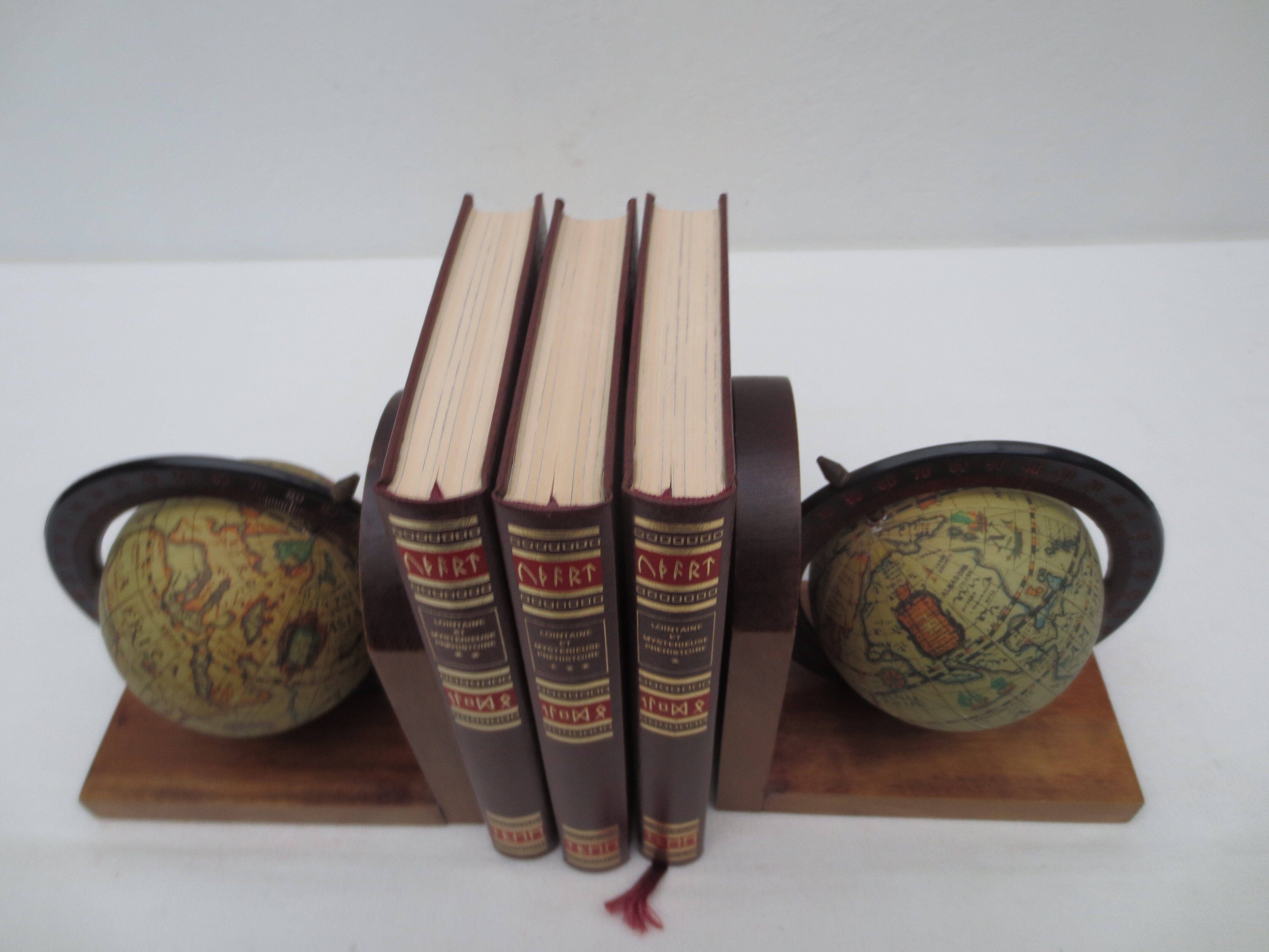 Old pair of greenhouse books in solid wood and world map