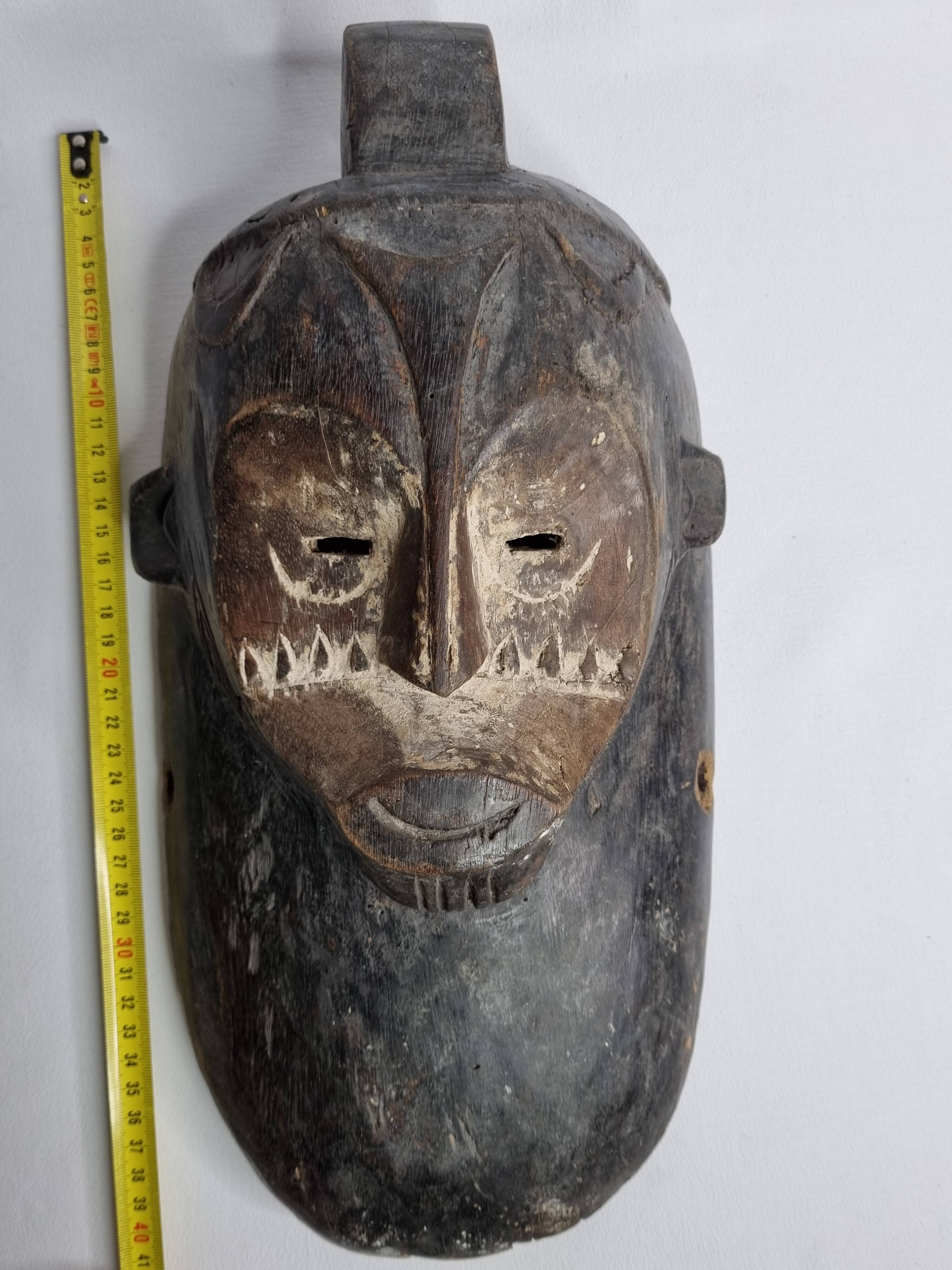 Ancient Fang Ngil tribal mask, traditional African art, Gabon, 20th century, 40 cm