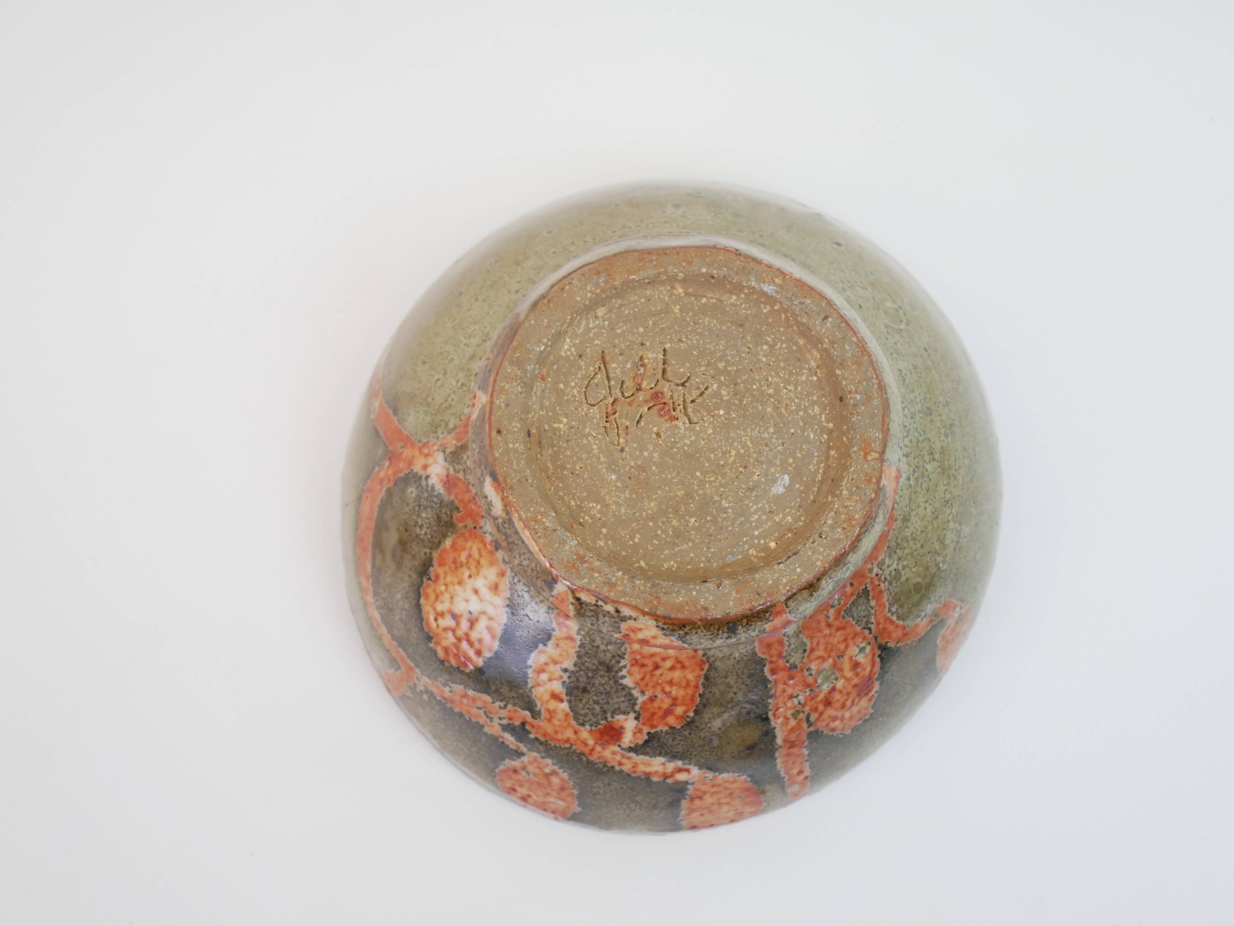 Small bowl in water green glazed ceramic with coral pink pattern