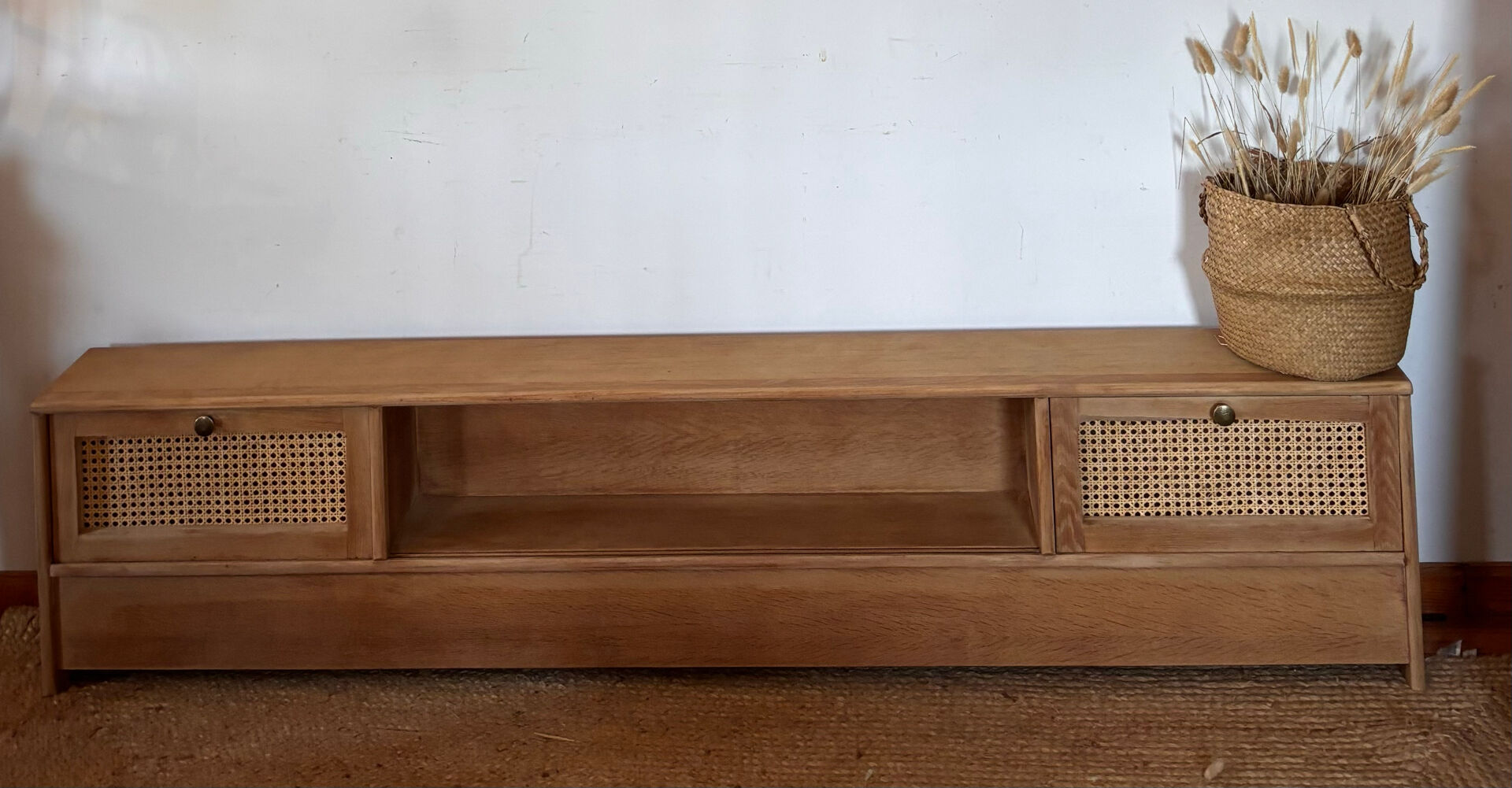 TV sideboard in raw oak and cane.