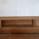 TV sideboard in raw oak and cane.
