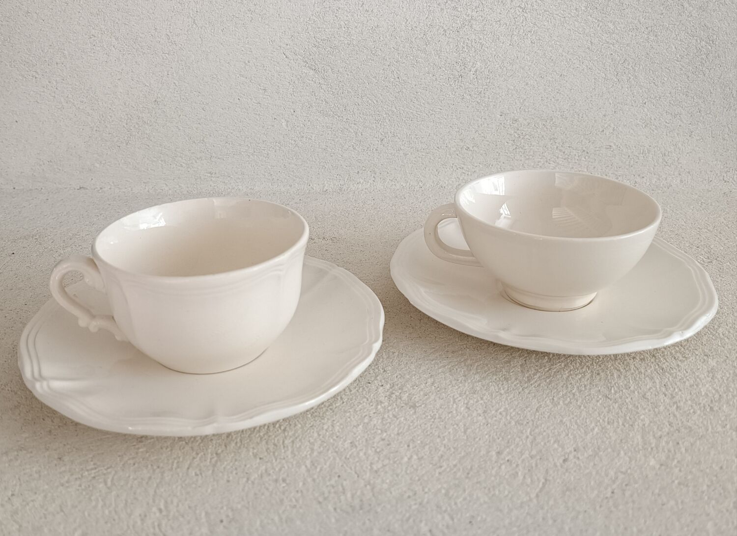 Two ivory cups and saucers from Sarreguemines