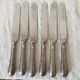 Silver round knives with stainless steel blades