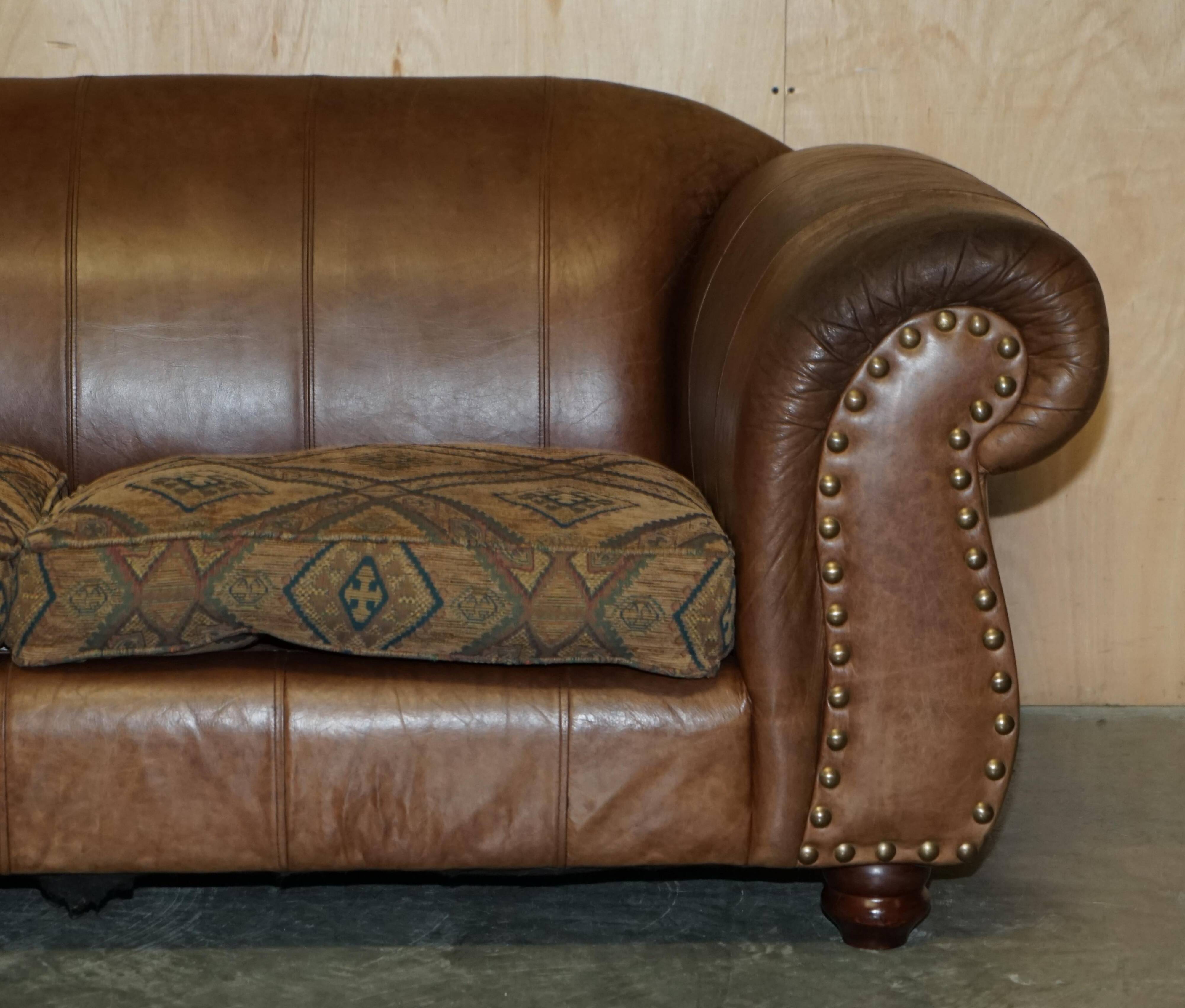 Vintage leather sofas by Thomas Lloyd with Kilim cushions.