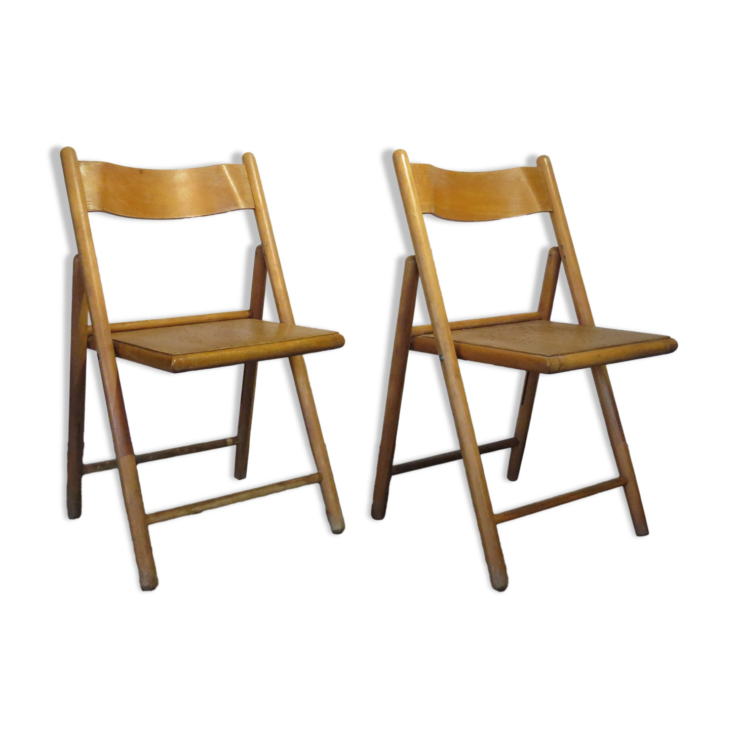 Pair of vintage wooden folding chairs with star pattern on seat