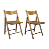 Pair of vintage wooden folding chairs with star pattern on seat