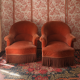Pair of pink velvet tub chairs in good condition.