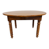 Oval dining table in solid wood with turned legs from the 1950s.