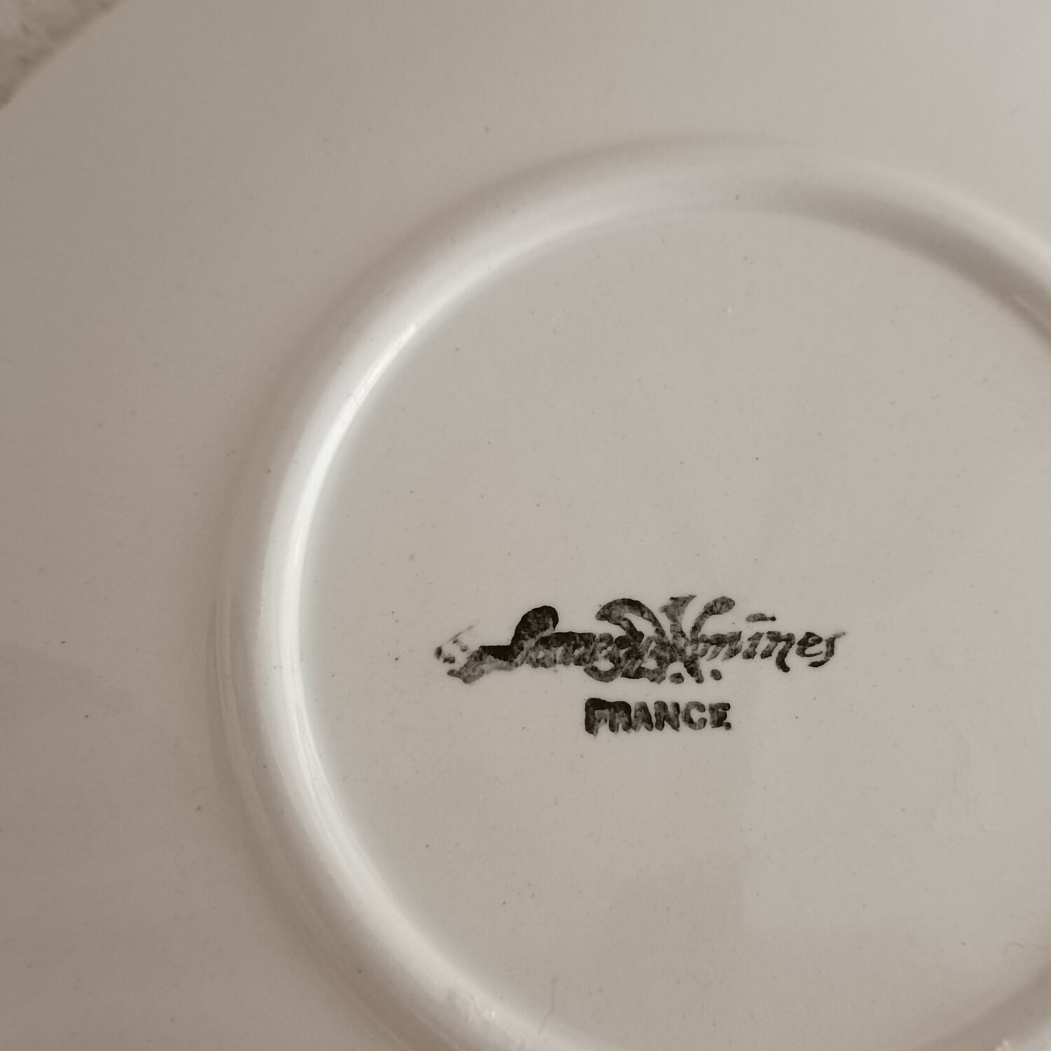 Two ivory cups and saucers from Sarreguemines