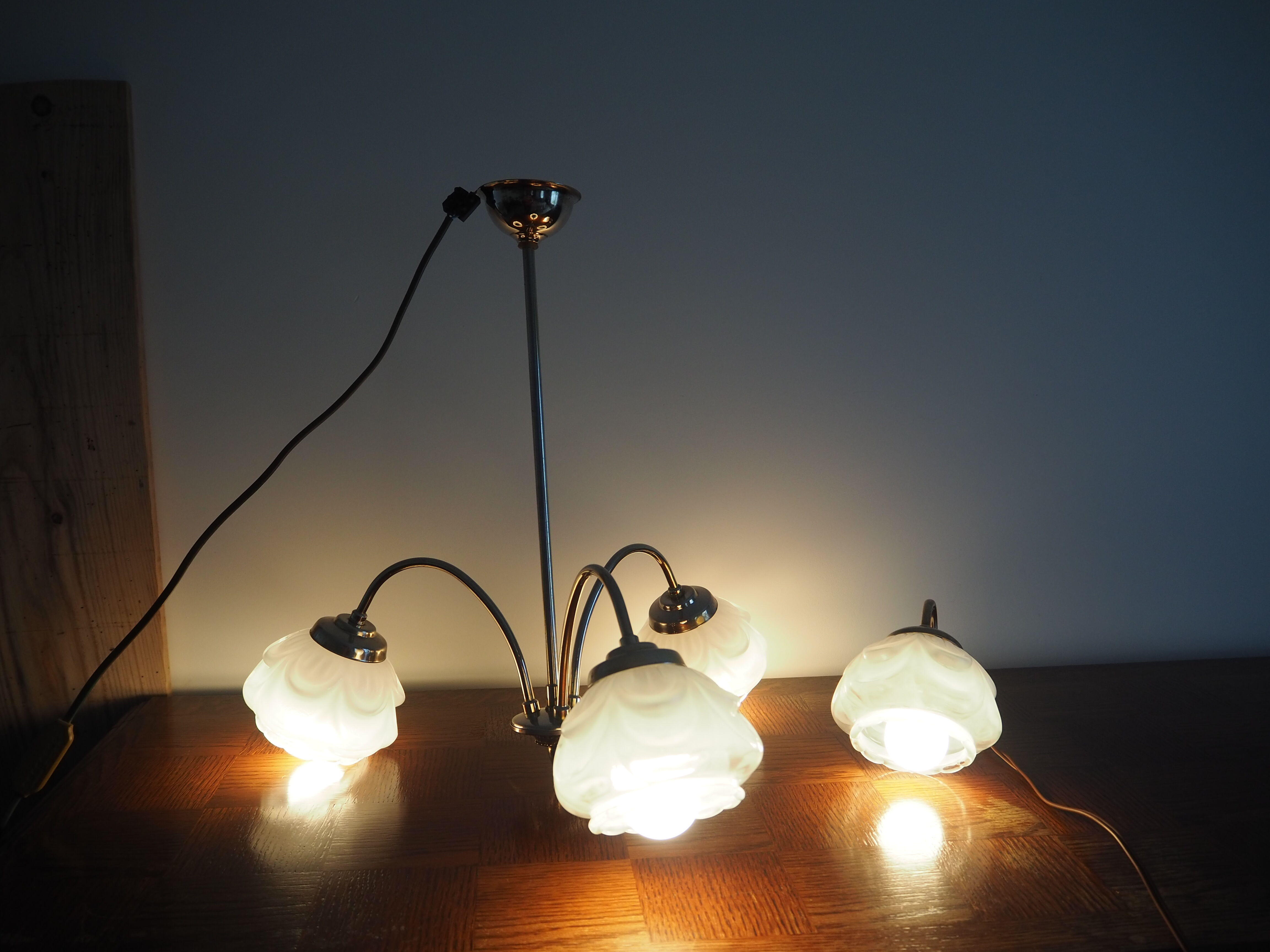 Brass wall lamp and white glass globe from the 1950s-1960s.
