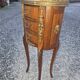 Oval bedside table in Louis XV style with marquetry.