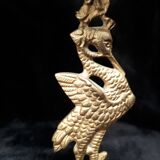 Pair of bronze candle holders decorated with herons