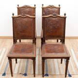 Set of 4 Louis XVI style chairs in carved wood and embossed leather.